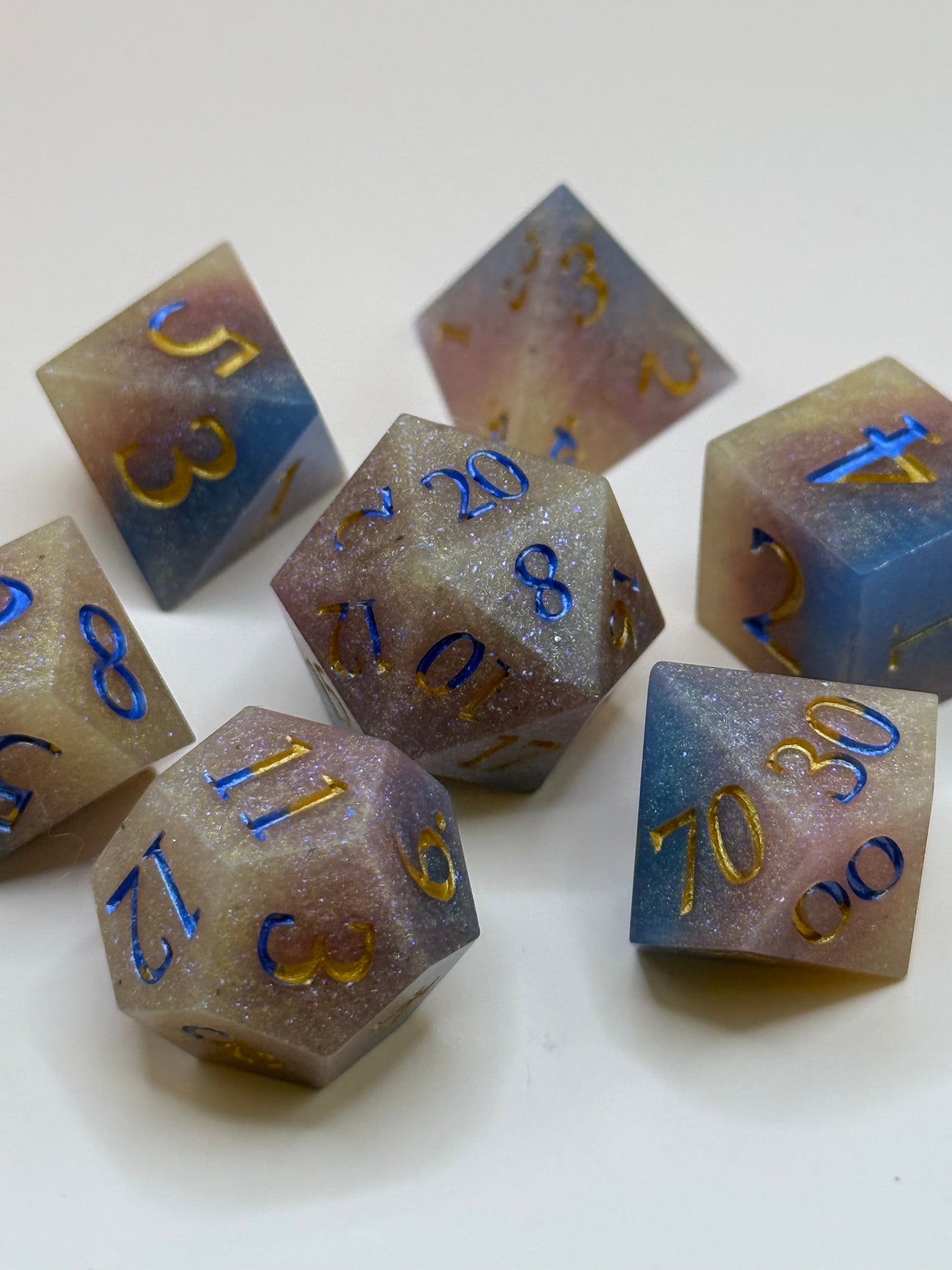 Set of polyhedral dice with numbers on a white background