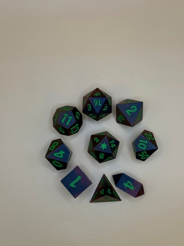 Set of polyhedral dice with black and green numbers on a white background