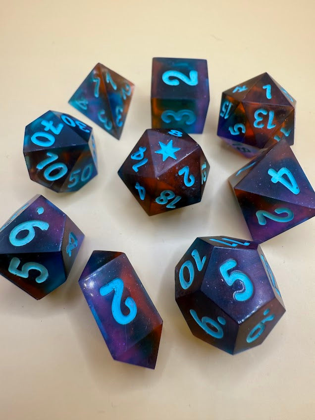 Set of polyhedral dice with blue numbers on a beige background