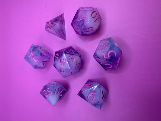 Set of purple polyhedral dice with pink numbers on a purple background