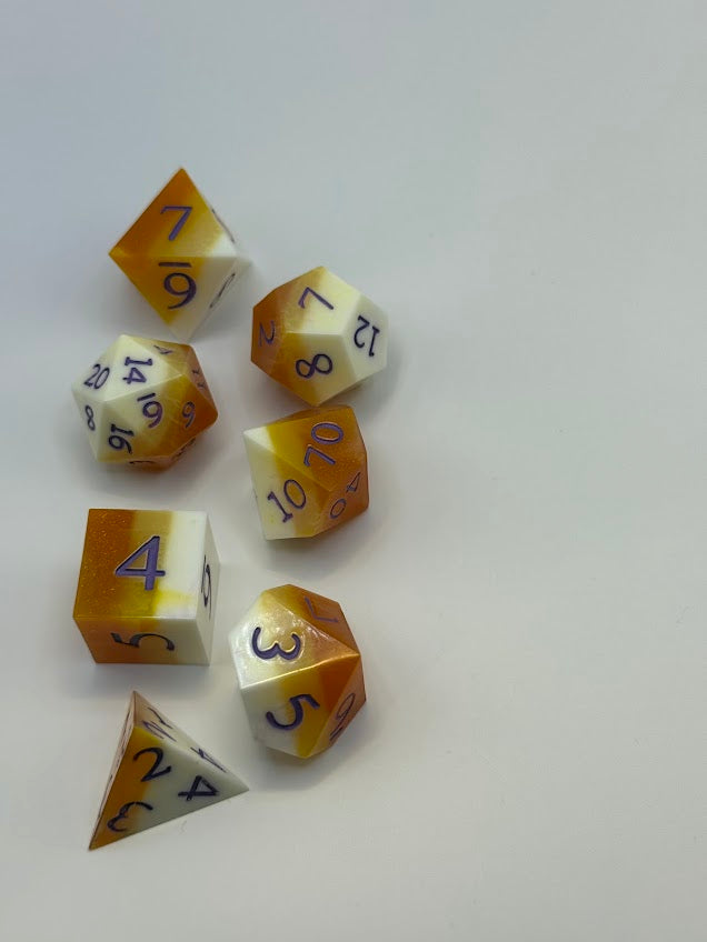 Set of polyhedral dice with gradient coloring on a white background