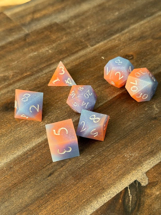 Set of colorful polyhedral dice on a wooden surface