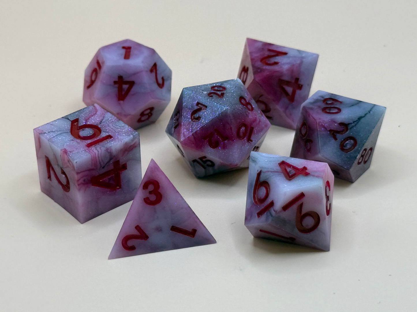 Set of red and black dice with red numbers on a white background