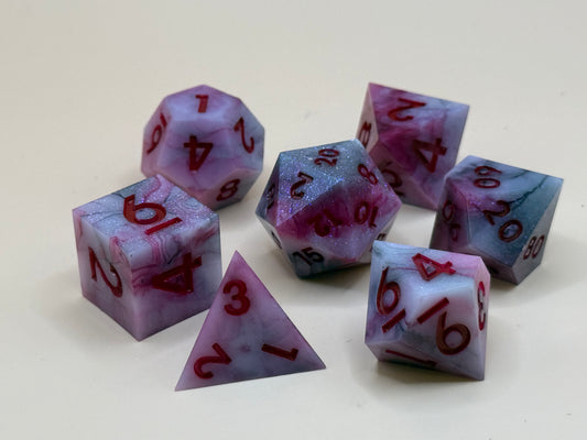 Set of red and black dice with red numbers on a white background