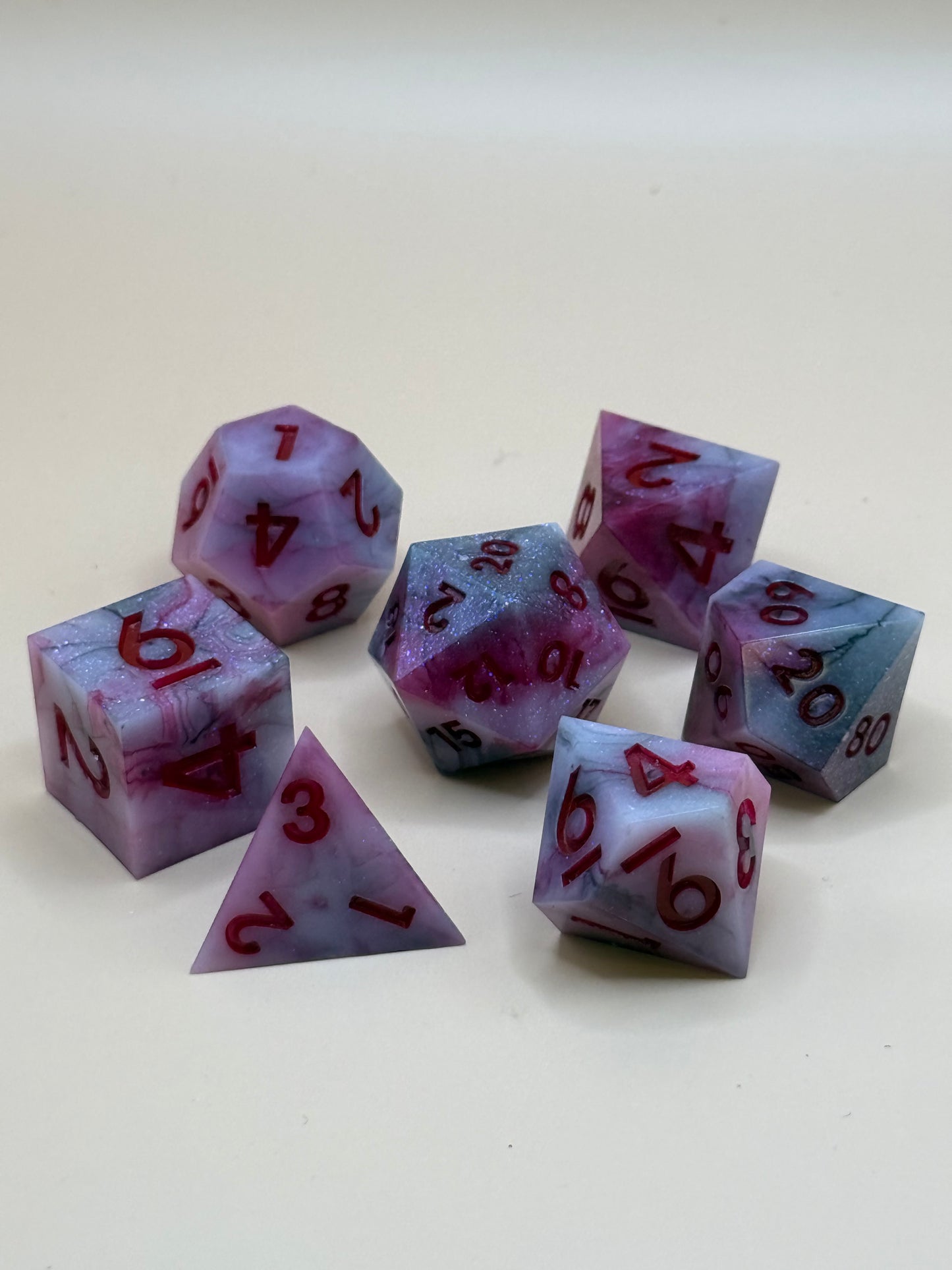 Set of red and black dice with red numbers on a white background