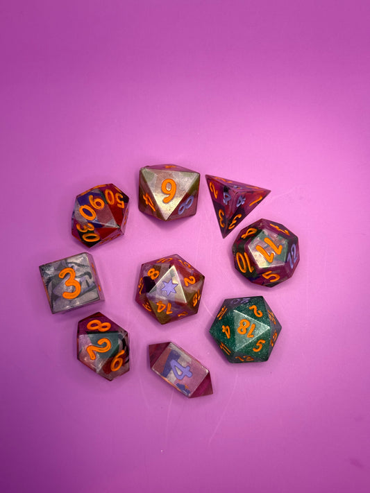 Set of polyhedral dice with numbers on a purple background