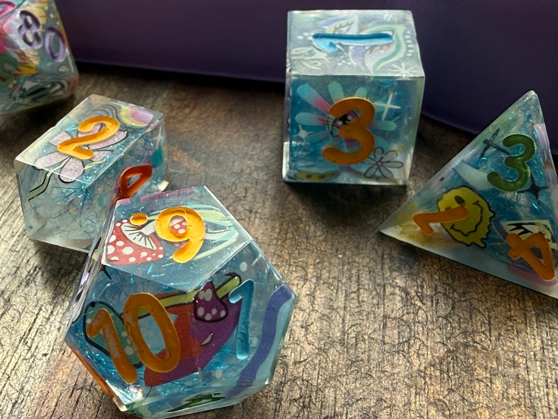 Colorful dice with numbers and shapes on a wooden surface