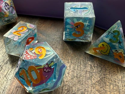 Colorful dice with numbers and shapes on a wooden surface