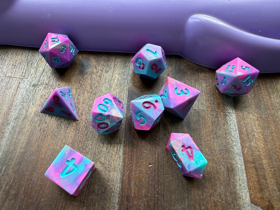 Set of colorful polyhedral dice on a wooden surface