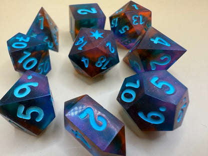 Set of polyhedral dice with blue numbers on a light background