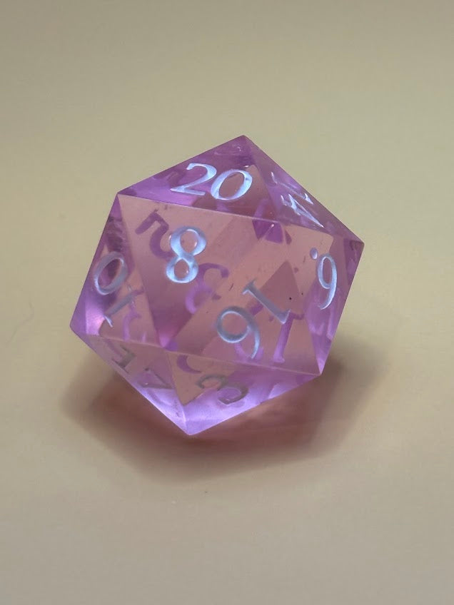 Purple polyhedral dice with numbers on a beige background