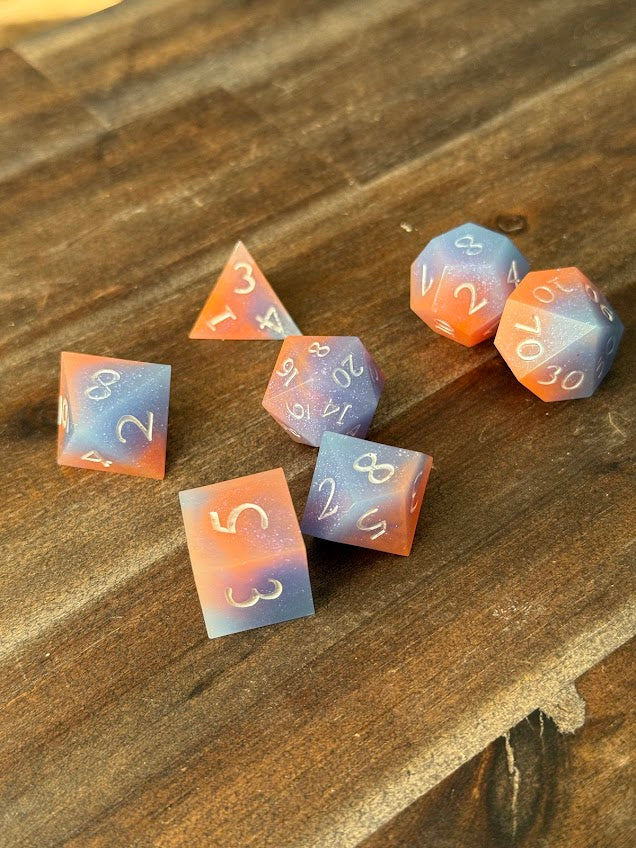 Set of colorful polyhedral dice on a wooden surface