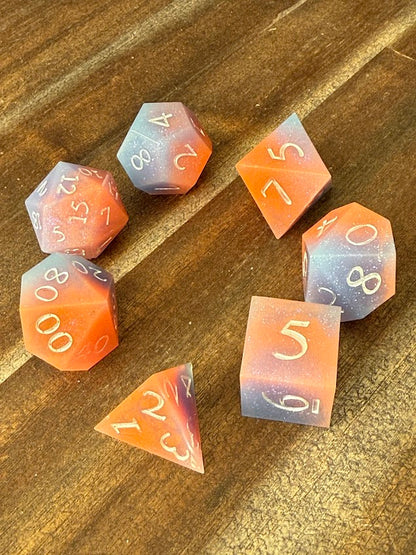 Set of colorful polyhedral dice on a wooden surface