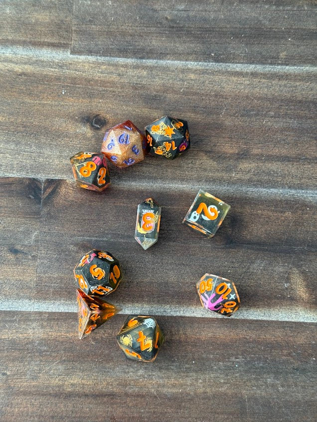 Set of dice with floral patterns on a wooden surface