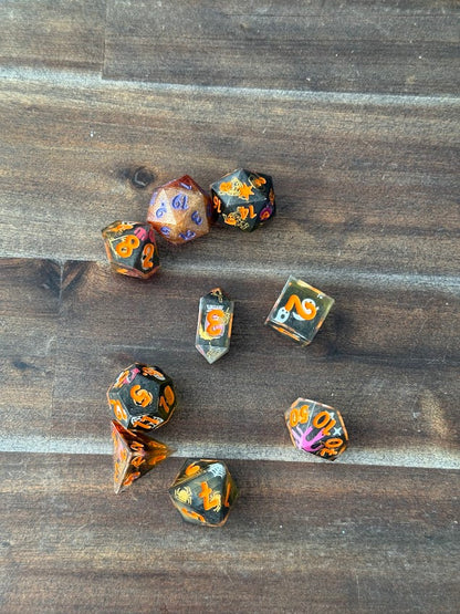 Set of dice with floral patterns on a wooden surface