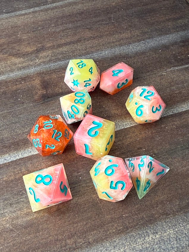 Set of colorful polyhedral dice on a wooden surface