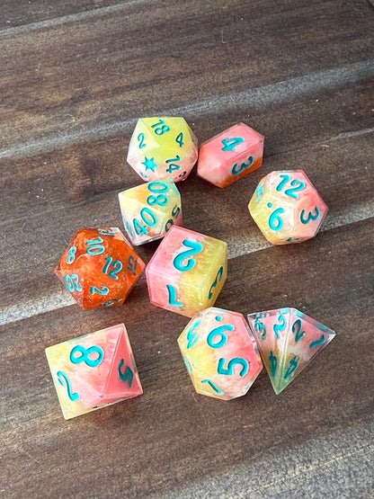 Set of colorful polyhedral dice on a wooden surface