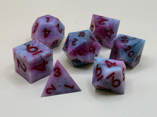 Set of red and black dice with red numbers on a white background