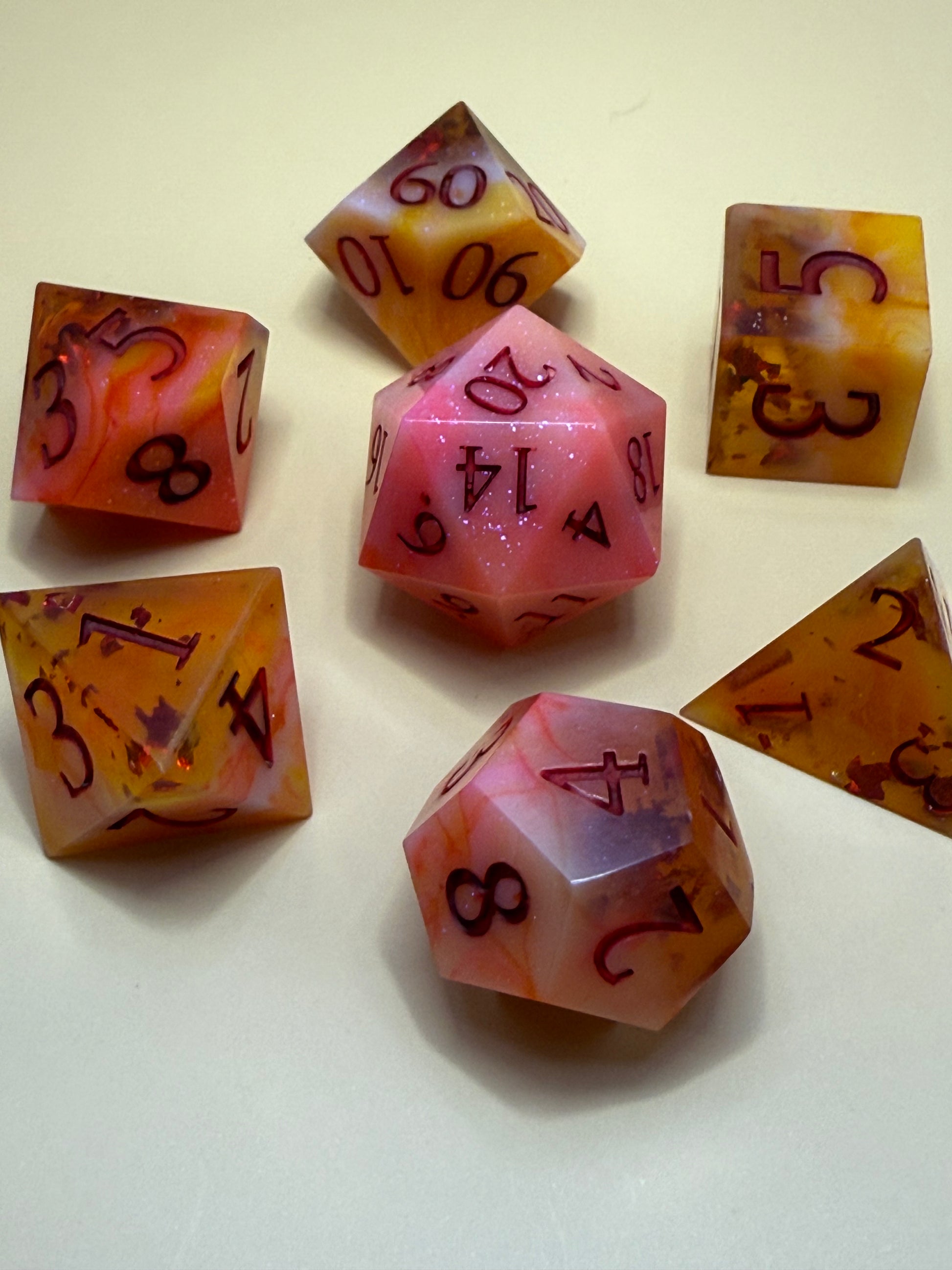 Set of colorful polyhedral dice on a light background