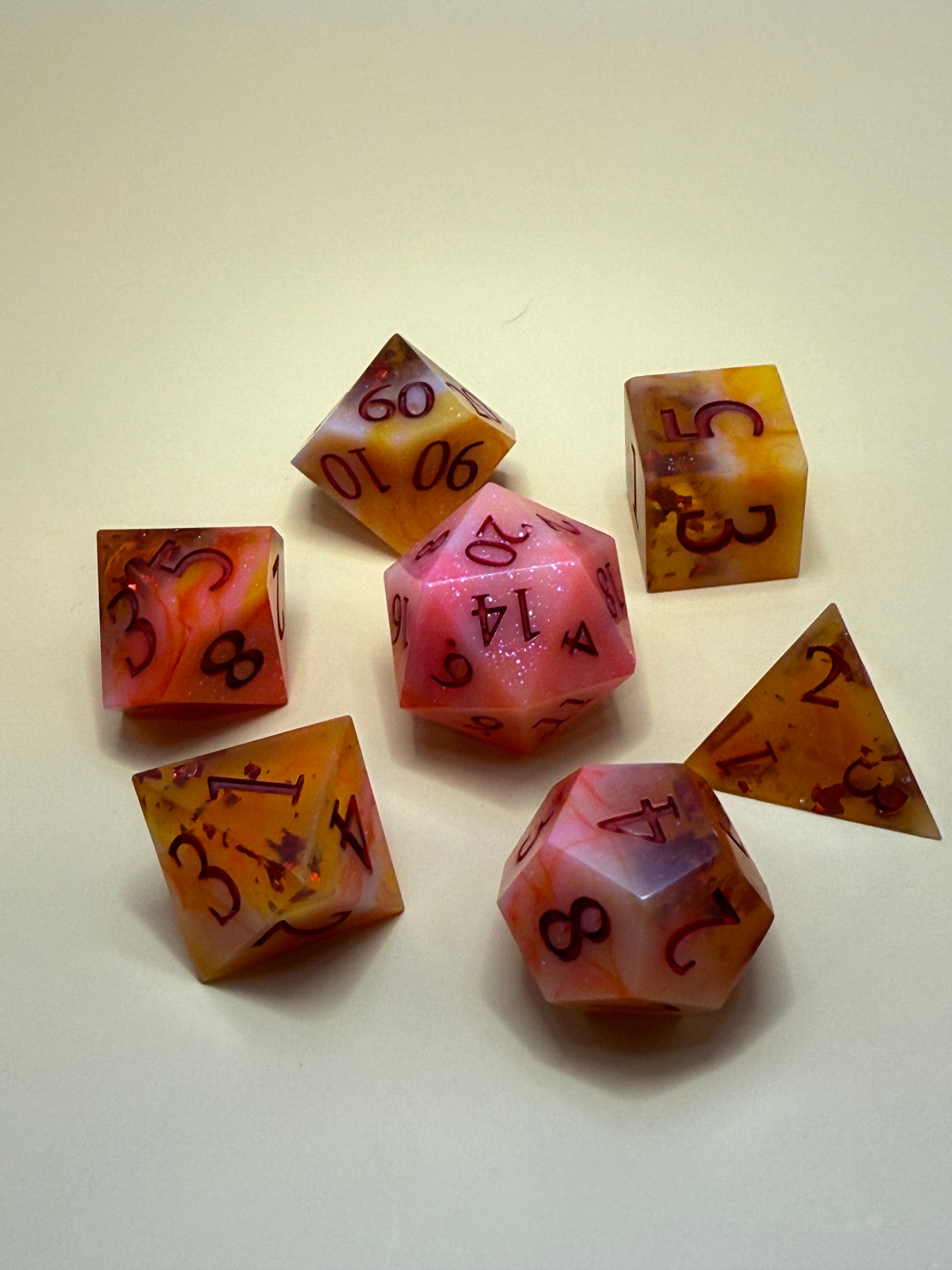 Set of colorful polyhedral dice on a light background