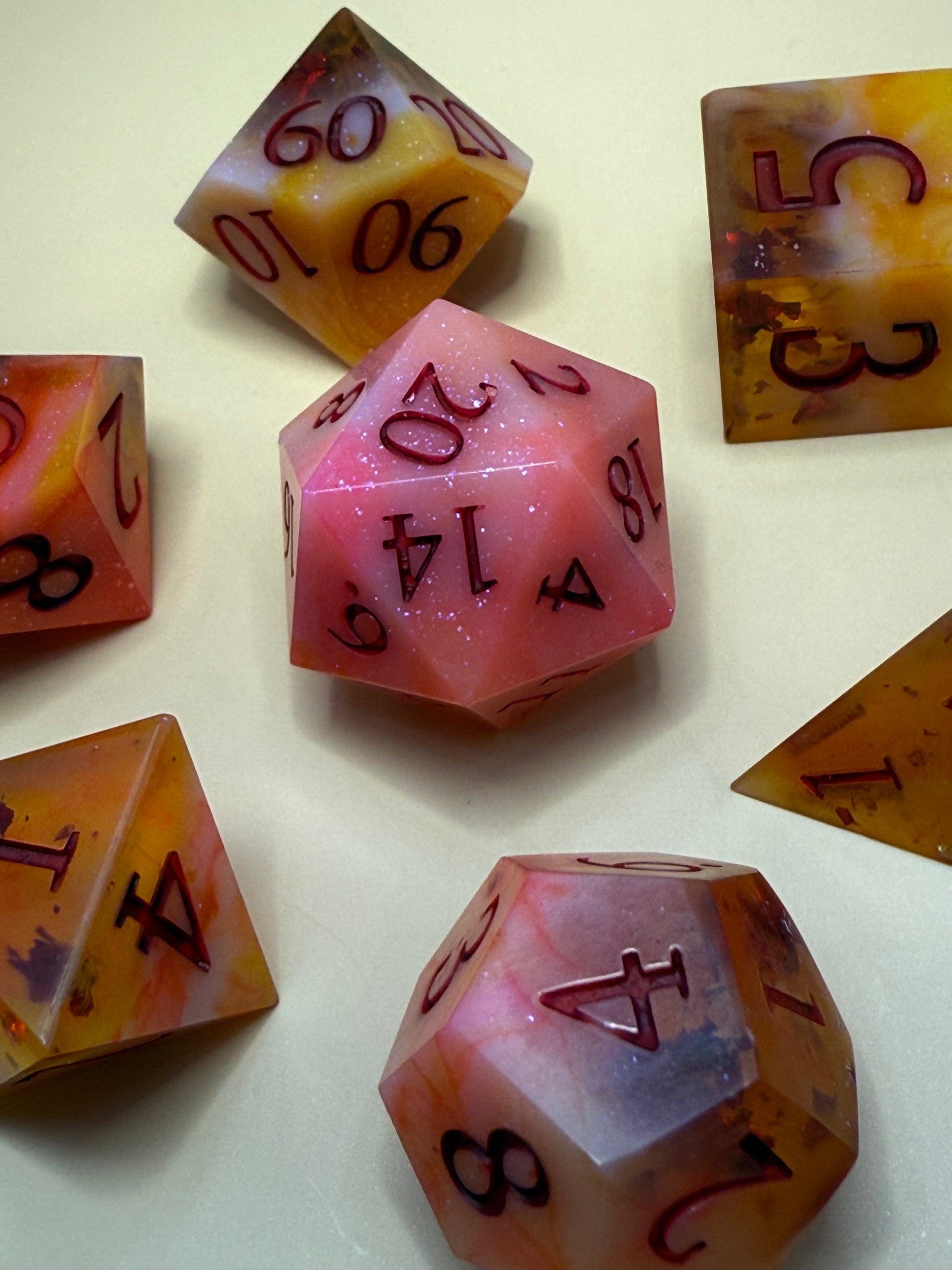 Set of colorful polyhedral dice on a light background