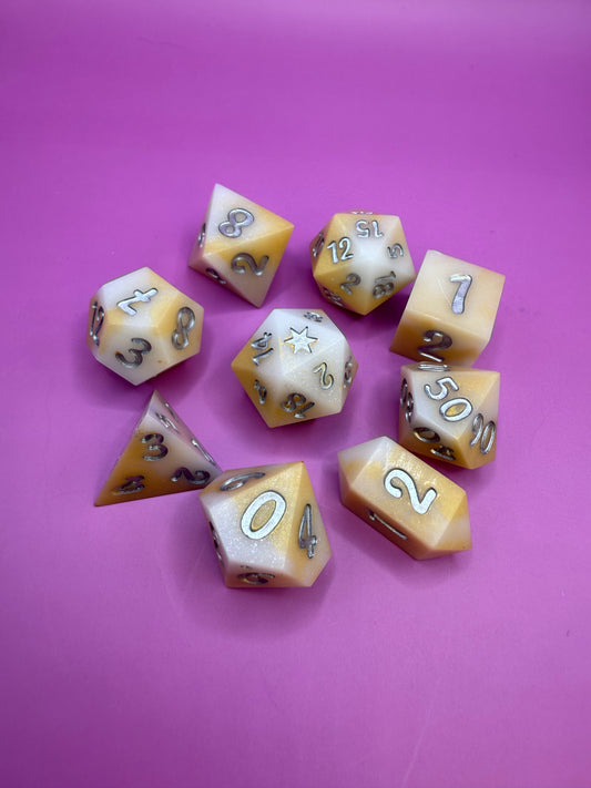 Set of dice with numbers on a pink background