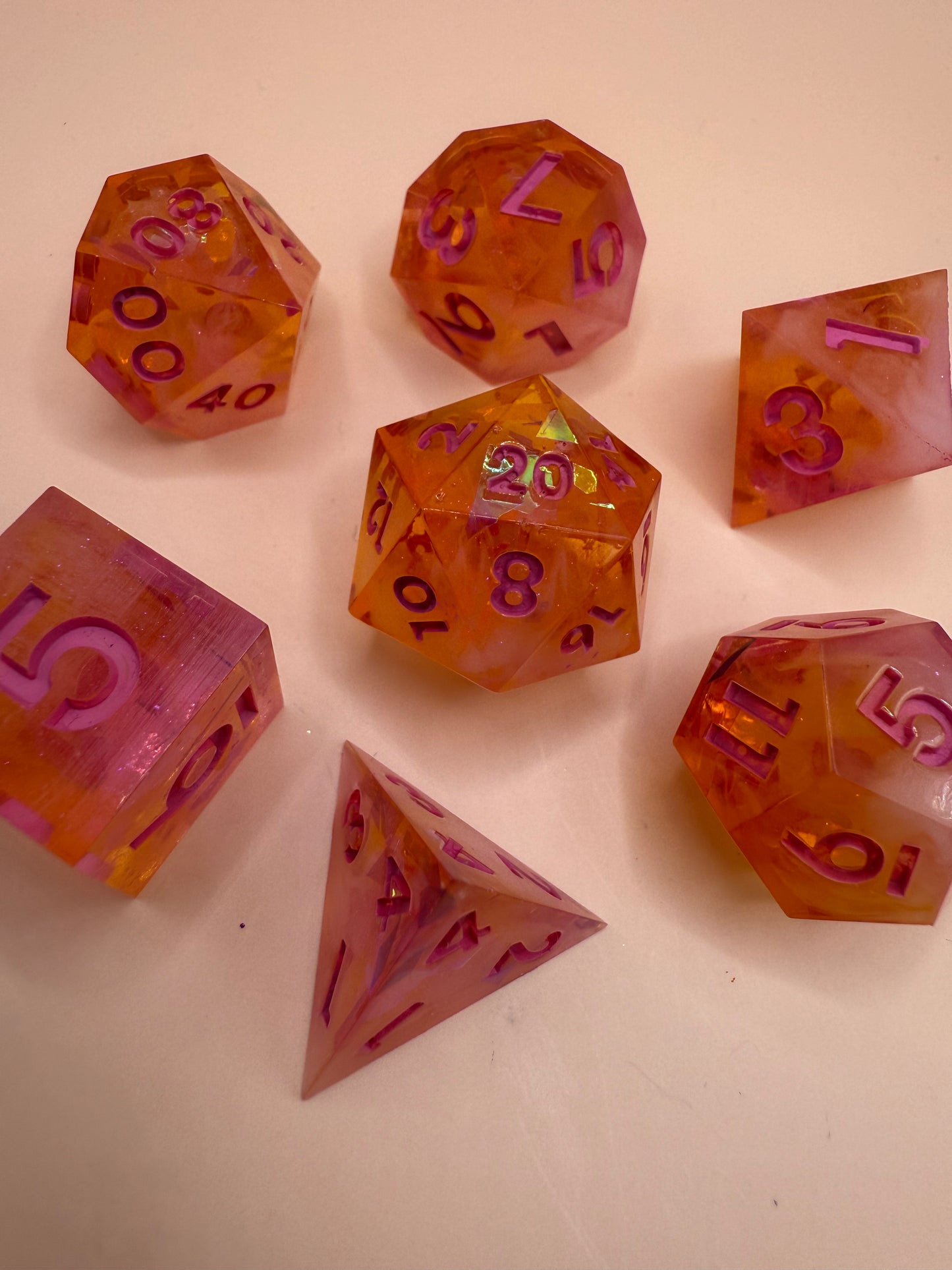 Set of colorful polyhedral dice on a light background